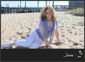 redhead transgender model janie black wholesome pretty cute girl in white capris lounging on sand near pier