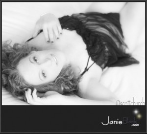 sexy redhead transgender model janie black in black teddy looking sultry and inviting