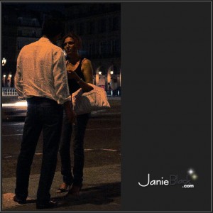 A man and woman outside a club exchanging numbers