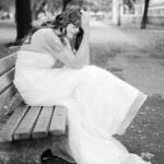 wedding dress model on a park bench